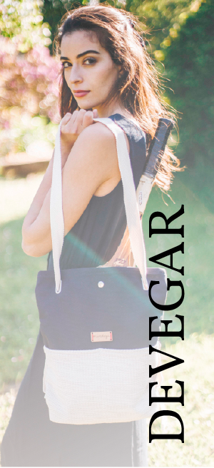 a woman with a bag over her shoulder